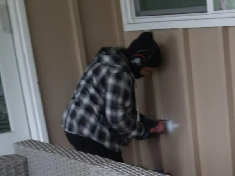 Professional electrician installing an exterior outlet in Needham