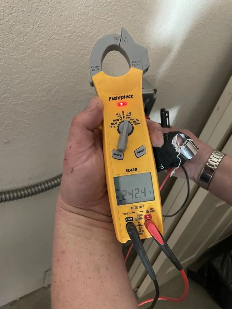 Voltage testing with clamp meter during Circuit Breaker Repair in Needham